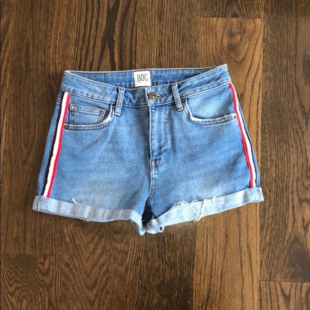 Blue denim shorts with red white and black stripe